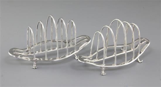 A pair of George V silver toast racks, by George Howson, Length 153mm weight 8.1oz/253grms